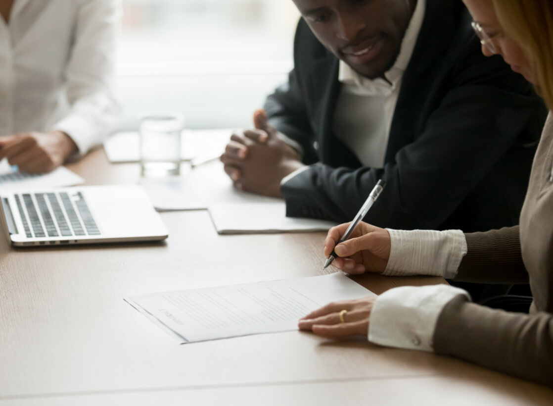 Lawyer helping a client with paperwork.