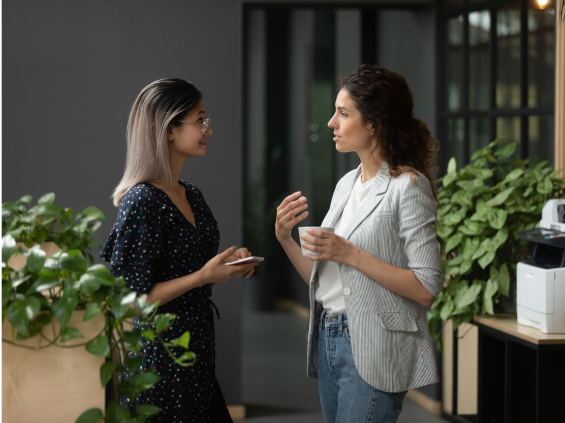 Two co-workers chatting.